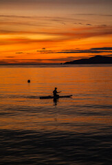 Sunset over wooden beach bar in sea and hut on pier in koh Mak island, Trat, Thailand