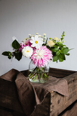 Bouquet of summer flowers on a wooden table - 466900657