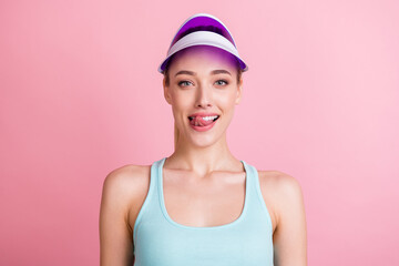 Portrait of attractive cheerful funky girlish girl licking lip good mood isolated over pink pastel color background