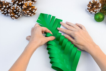 How to make a creative Christmas tree from colored paper and glue with your own hands. DIY concept....