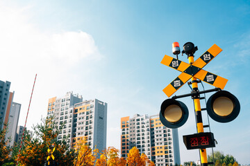 Hangdong Railroad crossing signal railroad barrier at autumn in Seoul, Korea