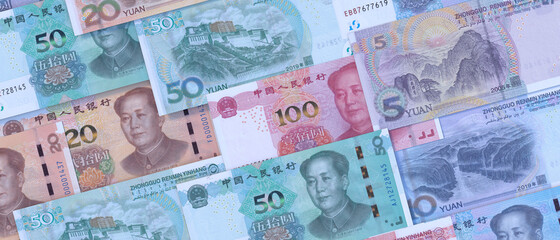 Chinese paper currency Yuan renminbi bill banknotes background. China economy, finance and banking