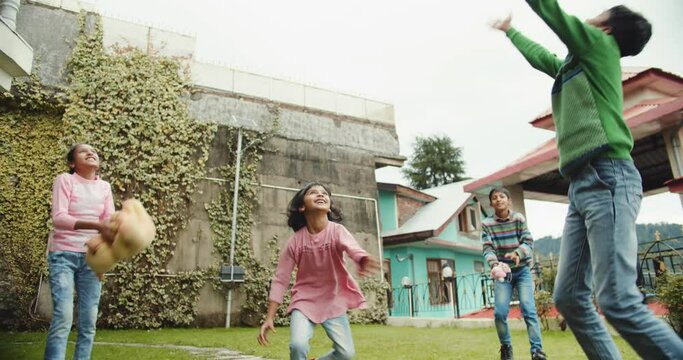 A group of happy Indian children playing outdoors in  Shimla, Himachal Pradesh, India