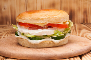vegetarian burger with cream cheese, cucumber and tomato