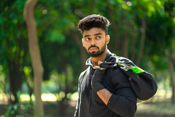 Young man holding fitness sports bag.