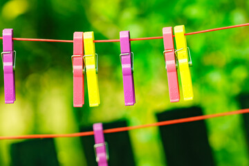 Clothes pegs on line outdoor. Housework