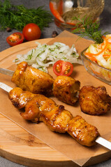 chicken shish kebab with pickled onions and cabbage salad