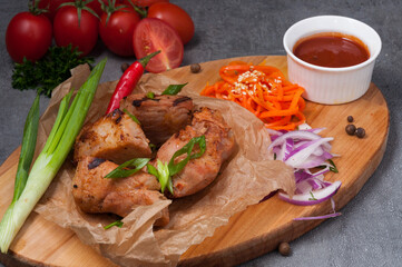 pork kebab with tomato sauce and green onions