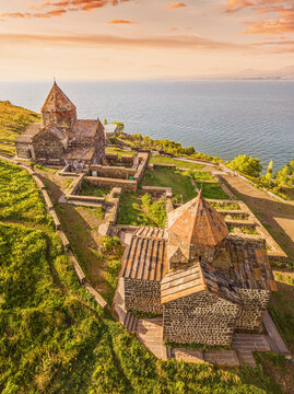 Drone panorama of Sevanavank Monastery and chapel overlooking famous Sevan lake at sunny spring day. Travel and tourist destinations of Armenia