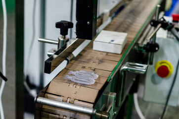 Close-up of automatic product labeling line
