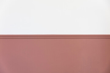 Modern interior with a painted victorian dado rail in pink and blank white wall above