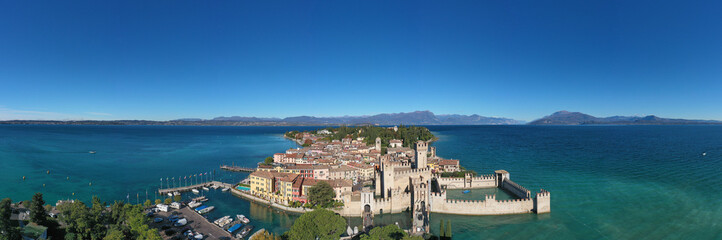Sirmione aerial view. Top view, historic center of the Sirmione peninsula, lake garda. Autumn in Sirmione. Lake Garda, Sirmione, Italy. Aerial panorama of Sirmione.