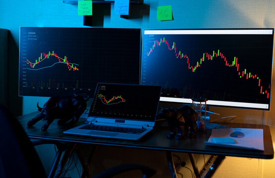 Focus On Laptop Chart, Concept Showing Of Trading Setup With Running Candle Stick Charts Of Stock Market Shares On Monitors For Data Analysis