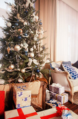 Christmas tree with big colourful presents white vertical