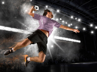 Caucasian young handball player in action - obrazy, fototapety, plakaty