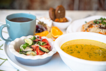 Business lunch. soup with chicken broth, flatbread and salad.