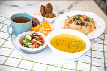 Business lunch. soup with chicken broth, flatbread and salad.
