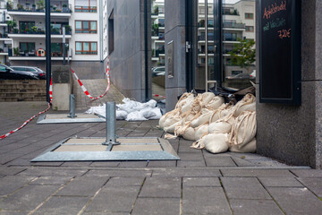 bags at the entrance in front of the building protect against floods