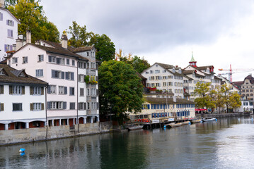 Fototapeta na wymiar Old town of Zürich with river Limmat on a grey cloudy autumn day. Photo taken October 9th, 2021, Zurich, Switzerland.