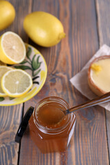 Lemon jam in a glass jar and other lemon desserts