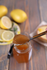 Lemon jam in a glass jar and other lemon desserts