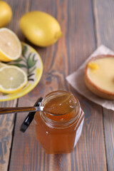Lemon jam in a glass jar and other lemon desserts