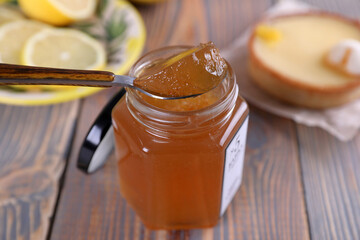 Lemon jam in a glass jar and other lemon desserts