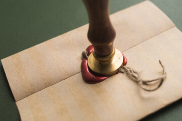 Sealing wax in a candle, a bar. Envelope with wax seal