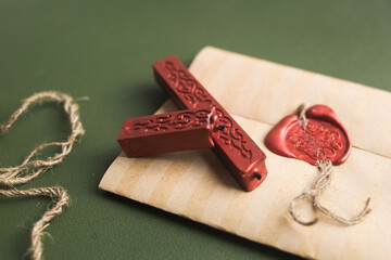 Sealing wax in a candle, a bar. Envelope with wax seal