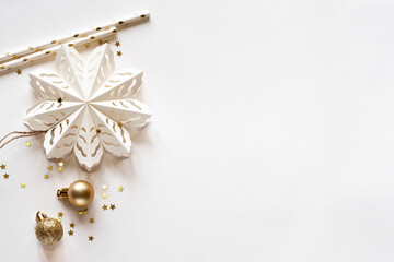 Obraz na płótnie Canvas Christmas card with snowflake and golden decor, top view