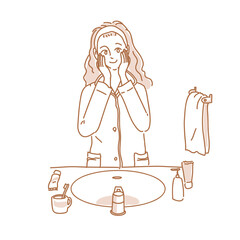 パジャマでスキンケアをする女性　