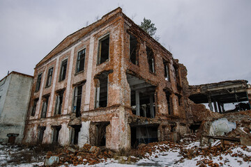 Remains of demolished old industrial building. Pile of stones, bricks and debris