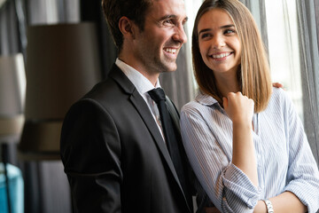 Young love couple smiling in the comfortable apartment