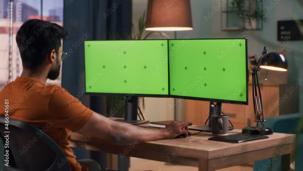 Poster indian man using computer in evening