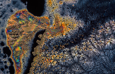 Extreme macro photograph of Vitamin C crystals forming abstract modern art patterns, when...