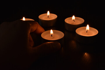 Tea light candles in the dark.