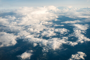Aerial view of clouds in the sky on sunny day