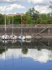 Sailboats moored at Lake Maggiore in the small port of Angera. Italy