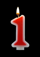 Red birthday candle isolated on black background, number 1