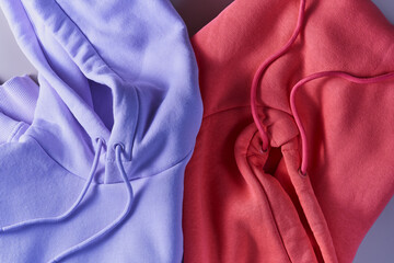 Close-up of two hoodie pink and violent trend colors with copy space.
