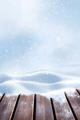 Winter background for Christmas design. Wooden surface made of boards and snowdrifts. Snow fall. Copy space.