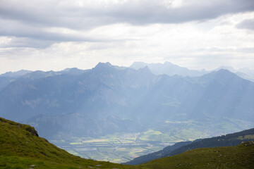 Fototapeta premium Amazing hiking day in one of the most beautiful area in Switzerland called Pizol in the canton of Saint Gallen. What a wonderful landscape in Switzerland at a sunny day. Beautiful alpine lake.