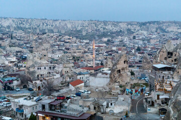 Naklejka premium Cappadocia Turkey. Houses of local residents, dug in the sandy rocks. Dwelling of ancient people. UNESCO Monument