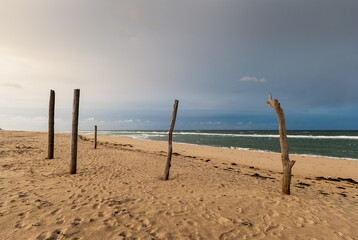 Deserted Cape Cod sandy beach on autumn stormy day
