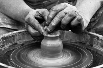 Hands and clay molding