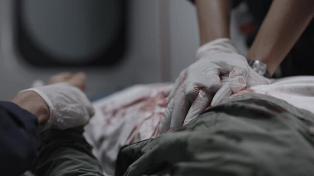 Paramedic doing heart massage for rescuing man
