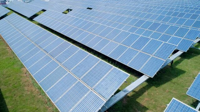 Aerial orbital view of Solar Panels Farm solar cell. Renewable green alternative energy concept. Close-up