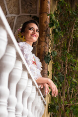 portrait of a latin american woman smiling. Multicultural ethnic diversity. Latin woman with typical Colombian dance costume. Latin American roots and cultures. 