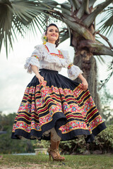 Latin woman with typical Colombian dance costume. Cultural heritages today. Latin American roots and cultures. Multicultural ethnic diversity