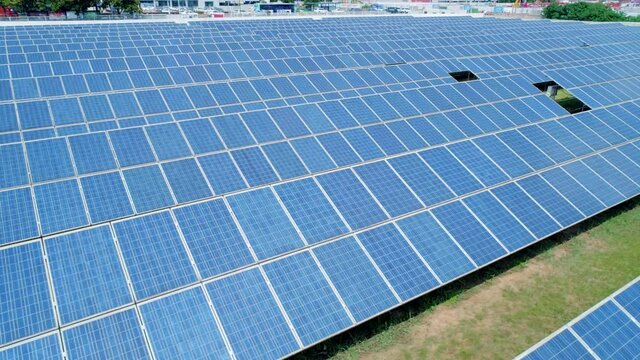 Aerial orbital view of Solar Panels Farm solar cell. Renewable green alternative energy concept. Close-up
